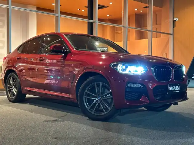 ＢＭＷ Ｘ４ xDrive 30i Mスポーツ 岐阜県 2019(令1)年 3.2万km 赤 ワンオーナー/アダプティブLEDヘッドライト/BMWヘッドアップディスプレイ/BMWライブ・コックピット/　マルチディスプレイメーターパネル/　HDDナビゲーションシステム/　電動フロントシート運転席助手席　運転席メモリー機能付/　フロントシートヒーティング/　リヤシートヒーティング/パーキングアシストプラス/　パーク・ディスタンス・コントロール/　パーキング・アシスト/　トップ・ビュー3Dビュー/　サイドビューカメラ/　リヤビューカメラ予想進路表示機能付/ドライビングアシストプラス/　アクティブクルーズコントロール　ストップゴー機能付/　ステアリング　レーンコントロールアシスト/　レーンディパーチャーウォーニング/　レーンチェンジウォーニング/　アクティブサイドコリジョンプロテクション/　前車接近警告機能/　衝突回避　被害軽減ブレーキ/　事故回避アシスト/　後車衝突警告機能/　クロストラフィックウォーニング