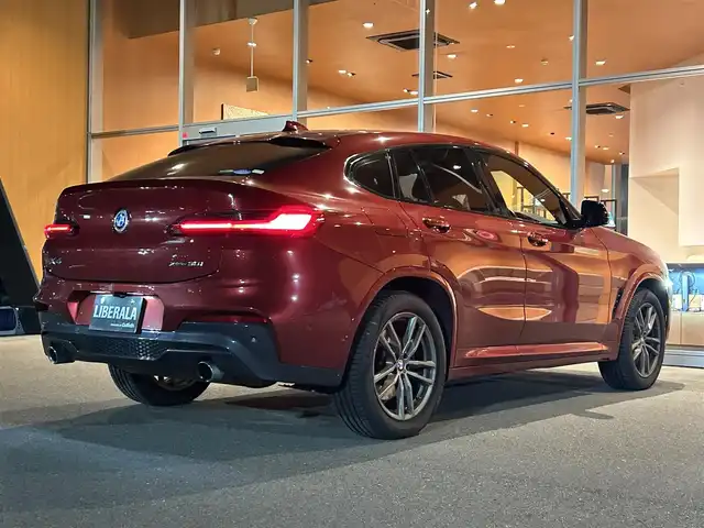 ＢＭＷ Ｘ４ xDrive 30i Mスポーツ 岐阜県 2019(令1)年 3.2万km 赤 ワンオーナー/アダプティブLEDヘッドライト/BMWヘッドアップディスプレイ/BMWライブ・コックピット/　マルチディスプレイメーターパネル/　HDDナビゲーションシステム/　電動フロントシート運転席助手席　運転席メモリー機能付/　フロントシートヒーティング/　リヤシートヒーティング/パーキングアシストプラス/　パーク・ディスタンス・コントロール/　パーキング・アシスト/　トップ・ビュー3Dビュー/　サイドビューカメラ/　リヤビューカメラ予想進路表示機能付/ドライビングアシストプラス/　アクティブクルーズコントロール　ストップゴー機能付/　ステアリング　レーンコントロールアシスト/　レーンディパーチャーウォーニング/　レーンチェンジウォーニング/　アクティブサイドコリジョンプロテクション/　前車接近警告機能/　衝突回避　被害軽減ブレーキ/　事故回避アシスト/　後車衝突警告機能/　クロストラフィックウォーニング