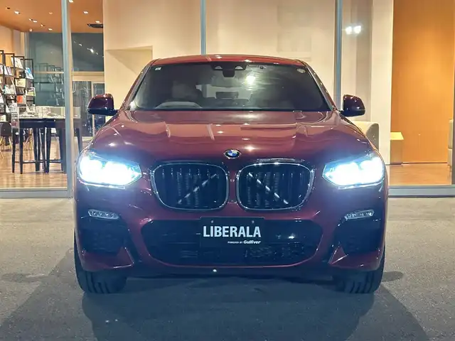 ＢＭＷ Ｘ４ xDrive 30i Mスポーツ 岐阜県 2019(令1)年 3.2万km 赤 ワンオーナー/アダプティブLEDヘッドライト/BMWヘッドアップディスプレイ/BMWライブ・コックピット/　マルチディスプレイメーターパネル/　HDDナビゲーションシステム/　電動フロントシート運転席助手席　運転席メモリー機能付/　フロントシートヒーティング/　リヤシートヒーティング/パーキングアシストプラス/　パーク・ディスタンス・コントロール/　パーキング・アシスト/　トップ・ビュー3Dビュー/　サイドビューカメラ/　リヤビューカメラ予想進路表示機能付/ドライビングアシストプラス/　アクティブクルーズコントロール　ストップゴー機能付/　ステアリング　レーンコントロールアシスト/　レーンディパーチャーウォーニング/　レーンチェンジウォーニング/　アクティブサイドコリジョンプロテクション/　前車接近警告機能/　衝突回避　被害軽減ブレーキ/　事故回避アシスト/　後車衝突警告機能/　クロストラフィックウォーニング