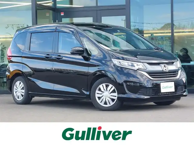 ホンダ フリード G ホンダセンシング 東京都 2020(令2)年 6.8万km プレミアムスパークルブラックパール 純正9インチナビ(VXM-207VFNi)/【DVD/CD/RADIO/TV/BT/SD】/バックカメラ/ビルトインETＣ/ドライブレコーダー/両側電動スライドドア/アダプティブクルーズコントロール/衝突軽減ブレーキ/車線維持支援システム/横滑り防止装置/アイドリングストップ/LEDヘッドライト/後席ロールサンシェイド/プッシュスタート/スマートキー