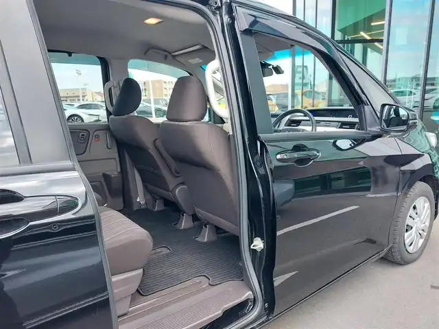 ホンダ フリード G ホンダセンシング 東京都 2020(令2)年 6.8万km プレミアムスパークルブラックパール 純正9インチナビ(VXM-207VFNi)/【DVD/CD/RADIO/TV/BT/SD】/バックカメラ/ビルトインETＣ/ドライブレコーダー/両側電動スライドドア/アダプティブクルーズコントロール/衝突軽減ブレーキ/車線維持支援システム/横滑り防止装置/アイドリングストップ/LEDヘッドライト/後席ロールサンシェイド/プッシュスタート/スマートキー