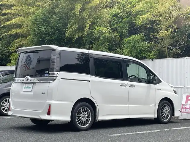 トヨタ ヴォクシー ハイブリッド ZS 煌 茨城県 2018(平30)年 8.4万km ホワイトパールクリスタルシャイン モデリスタエアロ（フロント）/純正ナビ/Ｂカメラ/ＥＴＣ/クルーズコントロール/衝突被害軽減ブレーキ/レーンキープ/両側電動スライドドア/シートヒーター/Ｗエアコン/純正１６インチＡＷ/ＬＥＤライト