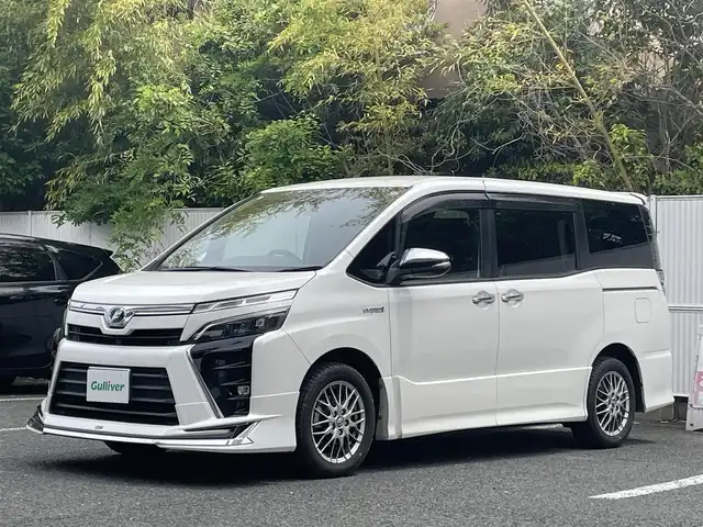トヨタ ヴォクシー ハイブリッド ZS 煌 茨城県 2018(平30)年 8.4万km ホワイトパールクリスタルシャイン モデリスタエアロ（フロント）/純正ナビ/Ｂカメラ/ＥＴＣ/クルーズコントロール/衝突被害軽減ブレーキ/レーンキープ/両側電動スライドドア/シートヒーター/Ｗエアコン/純正１６インチＡＷ/ＬＥＤライト