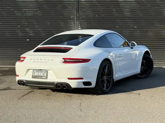 ポルシェ ９１１ カレラS 静岡県 2019(令1)年 2.6万km キャララホワイトメタリック ワンオーナー/スポーツクロノパッケージ/ポルシェダイナミックライトシステム/ポルシェアクティブサスペンションマネージメント/ポルシェエントリードライブシステム/純正ナビ/バックカメラ/Bluetooth接続/社外GPSレーダー/シートヒーター/シートベンチレーション/クリアランスソナー/メタリックペイント/レッドレザーシート/ツートンレザーインテリア/カレラSブラック塗装20インチAW/カラーセンターキャップ/ポルシェロゴ入りフロアマット