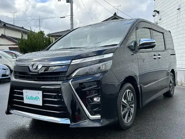 トヨタ ヴォクシー ZS 煌Ⅱ 山形県 2020(令2)年 3.9万km ブラック 純正9型ナビ/・(CD/DVD/フルセグ/BT)/フリップダウンモニター/バックカメラ/両側パワースライドドア/Toyota Safety Sense/・衝突軽減システム/・レーンキープアシスト/：オートハイビーム/クルーズコントロール/ビルトインETC2.0/純正アルミホイール/LEDヘッドライト/スマートキー