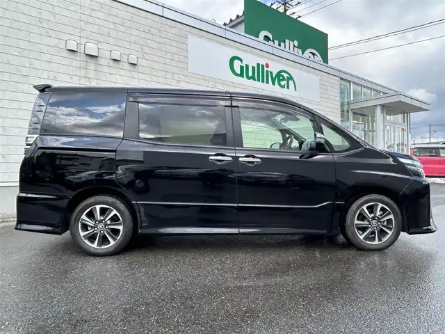 トヨタ ヴォクシー ZS 煌Ⅱ 山形県 2020(令2)年 3.9万km ブラック 純正9型ナビ/・(CD/DVD/フルセグ/BT)/フリップダウンモニター/バックカメラ/両側パワースライドドア/Toyota Safety Sense/・衝突軽減システム/・レーンキープアシスト/：オートハイビーム/クルーズコントロール/ビルトインETC2.0/純正アルミホイール/LEDヘッドライト/スマートキー