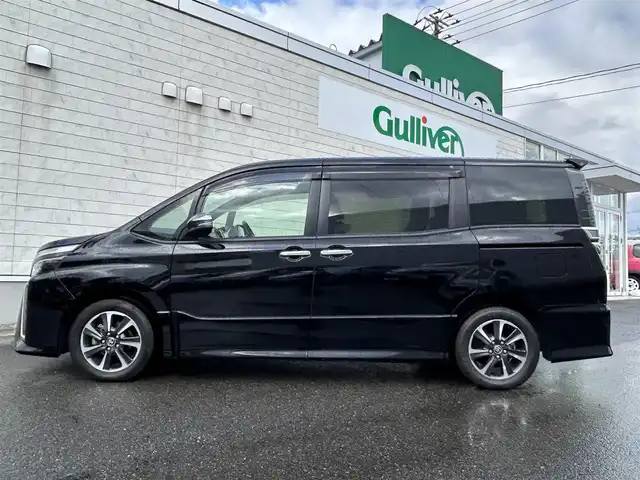 トヨタ ヴォクシー ZS 煌Ⅱ 山形県 2020(令2)年 3.9万km ブラック 純正9型ナビ/・(CD/DVD/フルセグ/BT)/フリップダウンモニター/バックカメラ/両側パワースライドドア/Toyota Safety Sense/・衝突軽減システム/・レーンキープアシスト/：オートハイビーム/クルーズコントロール/ビルトインETC2.0/純正アルミホイール/LEDヘッドライト/スマートキー