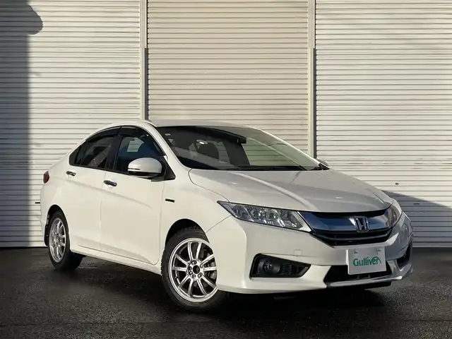ホンダ グレイス ハイブリッド EX 福島県 2015(平27)年 4.3万km ホワイトオーキッドパール 純正メモリーナビ/CD/DVD/SD/BT/フルセグTV/社外16インチAW(純正16AW＋夏タイヤ積込)/あんしんパッケージ/コンフォートビューパッケージ/クルーズコントロール/ハーフレザーシート/シートヒーター/バックカメラ/ステアリングリモコン/パドルシフト/ドライブレコーダー/オートライト/LEDヘッドライト/フォグライト/ビルトインETC/プッシュスタート/ドアバイザー/フロアマット