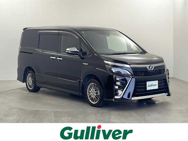 トヨタ ヴォクシー ハイブリッド ZS 煌Ⅱ 栃木県 2019(平31)年 8.2万km ブラック 純正10型ナビ/　　CD/DVD/Bluetooth/AM/FM/フルセグTV/バックカメラ/ビルトインETC2.0/トヨタセーフティーセンス /・プリクラッシュセーフティー/・レーンデパーチャーアラート/・オートマチックハイビーム/クルーズコントロール/前後クリアランスソナー/純正１２型フリップダウンモニター　/両側パワースライドドア　/純正ドライブレコーダー/純正１６インチアルミホイール　/前席シートヒーター　/ＥＴＣ　/ステアリングスイッチ　/スペアキー有り/プッシュスタート/スマートキー