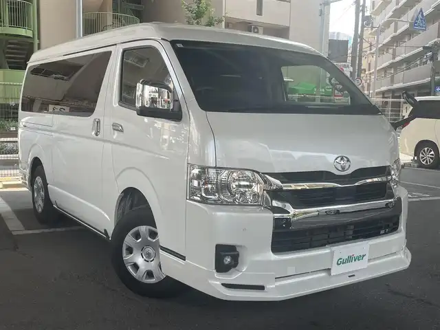 トヨタ ハイエース ファインテックツアラー 鹿児島県 2023(令5)年 2万km ホワイトパールクリスタルシャイン トヨタセーフティセンス/・プリクラッシュセーフティ/・レーンディパーチャーアラート/・オートマチックハイビーム/・パーキングブレーキサポート/モデリスタフルエアロ/トヨタ純正ナビ/・フルセグTV/・Bluetooth/・バックカメラ/・アラウンドビューモニター/純正フリップダウンモニター/両側パワースライドドア/LEDヘッドライト/オートライト/リラックスキャプテンシート/オートエアコン/プッシュスタート/ワンオーナー/新車保証書/取扱説明書