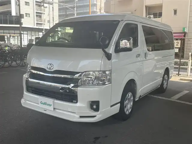トヨタ ハイエース ファインテックツアラー 鹿児島県 2023(令5)年 2万km ホワイトパールクリスタルシャイン トヨタセーフティセンス/・プリクラッシュセーフティ/・レーンディパーチャーアラート/・オートマチックハイビーム/・パーキングブレーキサポート/モデリスタフルエアロ/トヨタ純正ナビ/・フルセグTV/・Bluetooth/・バックカメラ/・アラウンドビューモニター/純正フリップダウンモニター/両側パワースライドドア/LEDヘッドライト/オートライト/リラックスキャプテンシート/オートエアコン/プッシュスタート/ワンオーナー/新車保証書/取扱説明書