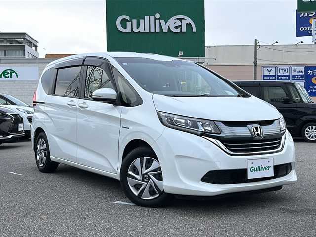 ホンダ フリード ハイブリット G ホンダセンシング 石川県 2018(平30)年 6.3万km ホワイトオーキッドパール 純正9型SDナビ(フルセグTV/CD/DVD/BT)/【VXM-187VFNi】/バックモニター/ホンダセンシング/両側パワースライドドア/前方ドライブレコーダー/ETC/純正LEDヘッドライト/純正フロアマット/スマートキー/スペアキー/プッシュスタート