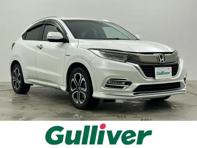 ホンダ ヴェゼル ハイブリッド Z ホンダセンシング 岡山県 2021(令3)年 4.5万km プラチナホワイトパール 純正８インチナビ/【Bluetooth/フルセグTV/Carplay/USB接続/CD/DVD/HDMI接続/USB接続】/型番:VXM-217VFEi/バックカメラ/前席シートヒーター/純正ドライブレコーダー（前後）/レーダークルーズコントロール/衝突軽減ブレーキ/ＬＥＤヘッドライト/フォグランプ/オートライト/ビルトインＥＴＣ/パドルシフト/アイドリングストップ/オートブレーキホールド/ルーフレール/スマートキー×1/新車保証書/取扱説明書/スペアキー×１