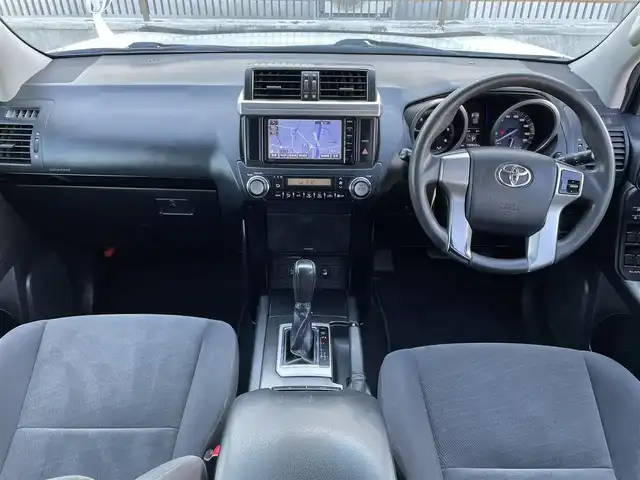 トヨタ ランドクルーザー プラド TX 道央・札幌 2015(平27)年 15.1万km ホワイトパールクリスタルシャイン 登録時走行距離150634km/　4　W　D　/寒冷地仕様/ディーゼルターボ/純正ディーラーOPナビ/バックカメラ/フロントワイパーデアイサー/ビルトインETC/電動格納ミラー/オールオートウィンドウ/ルーフレール/ダウンヒルアシストコントロール/プッシュスタート/純正フロアマット/純正ドアバイザー/スマートキー/スペアキー×１/純正AW付夏タイヤ積み込み