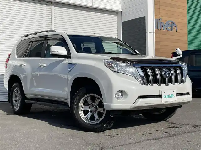 トヨタ ランドクルーザー プラド TX 道央・札幌 2015(平27)年 15.1万km ホワイトパールクリスタルシャイン 登録時走行距離150634km/　4　W　D　/寒冷地仕様/ディーゼルターボ/純正ディーラーOPナビ/バックカメラ/フロントワイパーデアイサー/ビルトインETC/電動格納ミラー/オールオートウィンドウ/ルーフレール/ダウンヒルアシストコントロール/プッシュスタート/純正フロアマット/純正ドアバイザー/スマートキー/スペアキー×１/純正AW付夏タイヤ積み込み