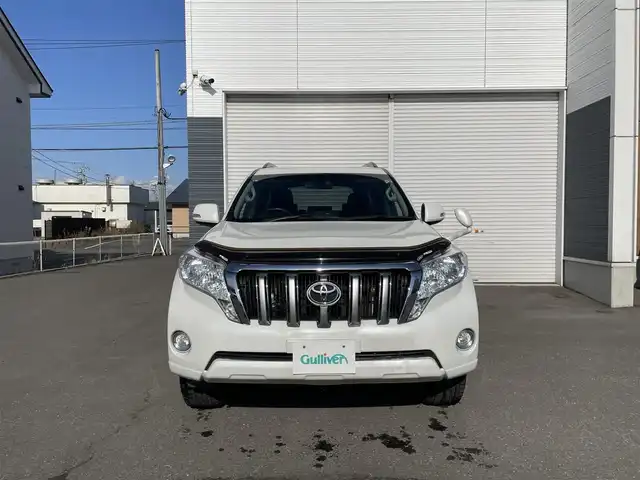トヨタ ランドクルーザー プラド TX 道央・札幌 2015(平27)年 15.1万km ホワイトパールクリスタルシャイン 登録時走行距離150634km/　4　W　D　/寒冷地仕様/ディーゼルターボ/純正ディーラーOPナビ/バックカメラ/フロントワイパーデアイサー/ビルトインETC/電動格納ミラー/オールオートウィンドウ/ルーフレール/ダウンヒルアシストコントロール/プッシュスタート/純正フロアマット/純正ドアバイザー/スマートキー/スペアキー×１/純正AW付夏タイヤ積み込み