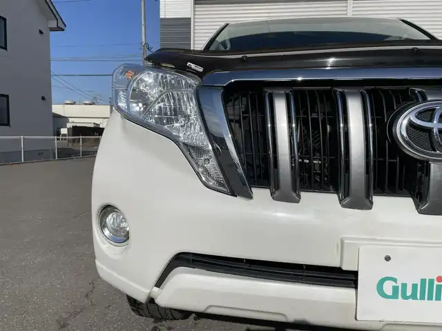 トヨタ ランドクルーザー プラド TX 道央・札幌 2015(平27)年 15.1万km ホワイトパールクリスタルシャイン 登録時走行距離150634km/　4　W　D　/寒冷地仕様/ディーゼルターボ/純正ディーラーOPナビ/バックカメラ/フロントワイパーデアイサー/ビルトインETC/電動格納ミラー/オールオートウィンドウ/ルーフレール/ダウンヒルアシストコントロール/プッシュスタート/純正フロアマット/純正ドアバイザー/スマートキー/スペアキー×１/純正AW付夏タイヤ積み込み
