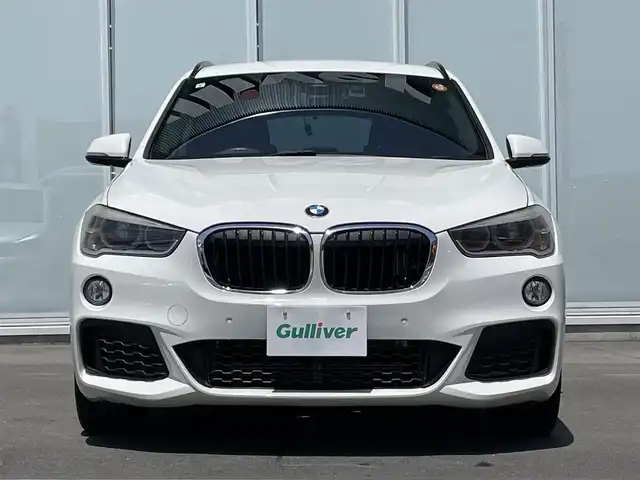 ＢＭＷ Ｘ１ sDrive 18i Mスポーツ 神奈川県 2016(平28)年 5.1万km アルピンホワイトⅢ ・前後ドライブレコーダー　/・ＭＴモード付きＡＴ　/・Ｗエアコン　/・衝突軽減システム　/・前後コーナーセンサー　/・純正１８インチアルミホイール　/・Bluetooth完備　/・ＢＭＷＭシリーズ　/・ＳＵＶ　/・車外バックカメラ