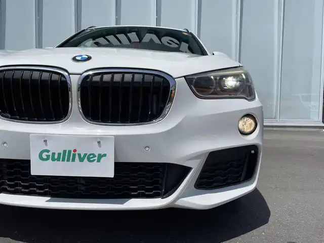ＢＭＷ Ｘ１ sDrive 18i Mスポーツ 神奈川県 2016(平28)年 5.1万km アルピンホワイトⅢ ・前後ドライブレコーダー　/・ＭＴモード付きＡＴ　/・Ｗエアコン　/・衝突軽減システム　/・前後コーナーセンサー　/・純正１８インチアルミホイール　/・Bluetooth完備　/・ＢＭＷＭシリーズ　/・ＳＵＶ　/・車外バックカメラ