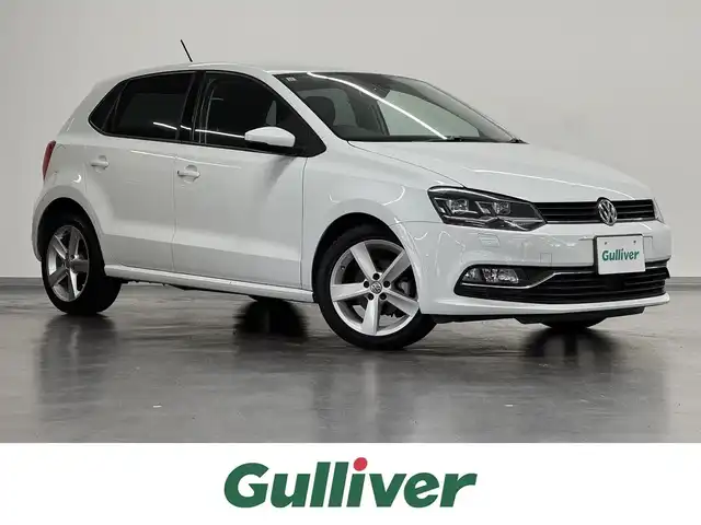 フォルクスワーゲン ポロ TSIハイライン 三重県 2017(平29)年 2万km ピュアホワイト プレミアムガソリン/FF/MTモード付フロア7AT（DSG）/【OP】純正 7インチナビ 716SDCW*/（FM/AM/TV/MUSIC CATCHER/USB/iPod/CD/DVD/Bluetooth/SD/VTR）/バックカメラ/【OP】ETC2.0*/安全/・プリクラッシュブレーキシステム“Front Assist”（シティエマージェンシーブレーキ機能付）/・ドライバー疲労検知システム“Fatigue Detection System”/・アダプティブクルーズコントロール“ACC”（全車速追従機能付）/・エマージェンシーストップシグナル/・ポストコリジョンブレーキシステム/・衝突感知自動ロック解除機能/・ESC（エレクトロニック・スタビリティ・コントロール）/など/装備/・ハーフレザーシート（アルカンターラ＆レザレット）/・シートヒーター（D/N）/・オートエアコン/・オートライト/・LEDヘッドライト（オートハイトコントロール機能、LEDポジションランプ付）/・フォグランプ（フロント、リヤ）/・レインセンサー/・自動防眩ルームミラー/・パドルシフト/・ステアリングスイッチ/・電動格納ドアミラー/・純正16inAW/・リモコンドアロック付折畳み式メインキーx2/・保/取/など