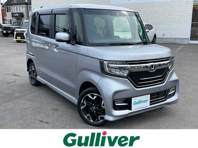 ホンダ Ｎ ＢＯＸ カスタム G EX ターボ ホンダセンシング 道東・釧路十勝 2018(平30)年 11.1万km ルナシルバーM 4WD/純正ナビ　VXU-185NBi/　(AM/FM/CD/DVD/BT)/エンジンスターター/ドライブレコーダー/ビルトインETC/バックカメラ/両側パワースライドドア/ハーフレザーシート/シートヒーター/純正15インチAW/純正フロアマット/ドアバイザー/MTモード付AT/コーナーセンサー/レーンキープアシスト/オートライト/ライトレベライザー/フォグランプ/盗難防止装置/ABS/横滑り防止装置/USB入力端子