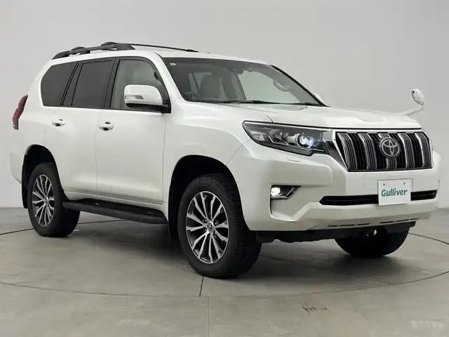 トヨタ ランドクルーザー プラド TX Lパッケージ 愛知県 2020(令2)年 4万km ホワイトパールクリスタルシャイン トヨタセーフティーセンス/・レーンキープアシスト/・衝突軽減ブレーキ/・クリアランスソナー/・横滑り防止装置/レーダークルーズコントロール/サンルーフ/ルーフレール/7人乗り/ベージュレザーシート/ALPINE９型ナビ/・フルセグTV/・Bluetooth/・CD/・DVD/・HDMI/デジタルインナーミラー/前後ドライブレコーダー/バックカメラ/ＥＴＣ　/ワイパーデアイザー　/パワーシート　/シートヒーター　/エアーシート　/アルミホイール　/スマートキー