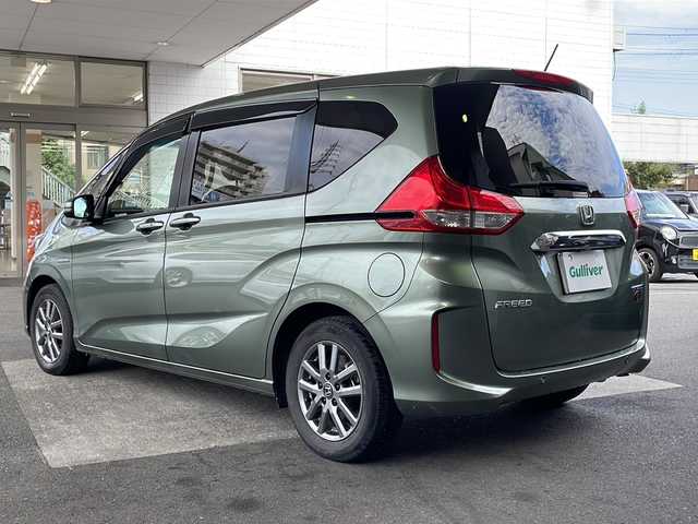 ホンダ フリード ハイブリット G ホンダセンシング 京都府 2021(令3)年 6万km シルバーミストグリーンM ワンオーナー /無限ドアパーツ /7インチ純正SDナビ（VXM-214VFi）/フルセグTV/Bluetooth/CD/DVD再生機能/iPod/AUX/USB/衝突軽減ブレーキ /禁煙 /両側パワースライドドア /後方コーナーセンサー /クルコン追従有 /レーンキープアシスト/シートヒーター/エアシート /シートカバー付/前方純正ドライブレコーダー /純正AW15インチ/ウィンカーミラー/オートライト
