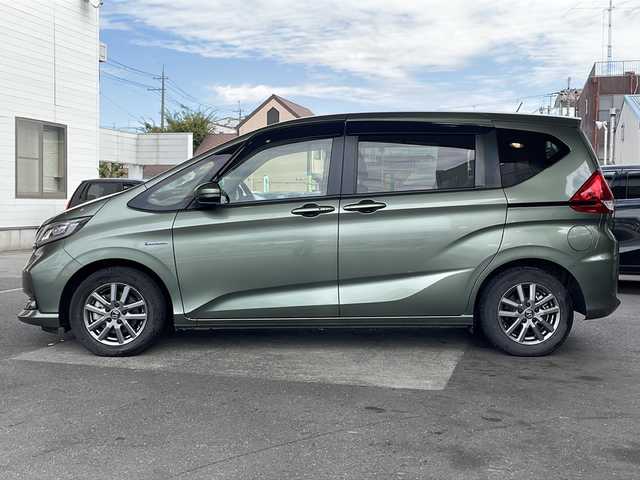 ホンダ フリード ハイブリット G ホンダセンシング 京都府 2021(令3)年 6万km シルバーミストグリーンM ワンオーナー /無限ドアパーツ /7インチ純正SDナビ（VXM-214VFi）/フルセグTV/Bluetooth/CD/DVD再生機能/iPod/AUX/USB/衝突軽減ブレーキ /禁煙 /両側パワースライドドア /後方コーナーセンサー /クルコン追従有 /レーンキープアシスト/シートヒーター/エアシート /シートカバー付/前方純正ドライブレコーダー /純正AW15インチ/ウィンカーミラー/オートライト
