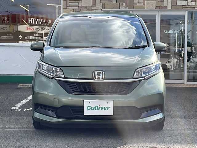 ホンダ フリード ハイブリット G ホンダセンシング 徳島県 2021(令3)年 6万km シルバーミストグリーンM ワンオーナー /無限ドアパーツ /7インチ純正SDナビ（VXM-214VFi）/フルセグTV/Bluetooth/CD/DVD再生機能/iPod/AUX/USB/衝突軽減ブレーキ /禁煙 /両側パワースライドドア /後方コーナーセンサー /クルコン追従有 /レーンキープアシスト/シートヒーター/エアシート /シートカバー付/前方純正ドライブレコーダー /純正AW15インチ/ウィンカーミラー/オートライト
