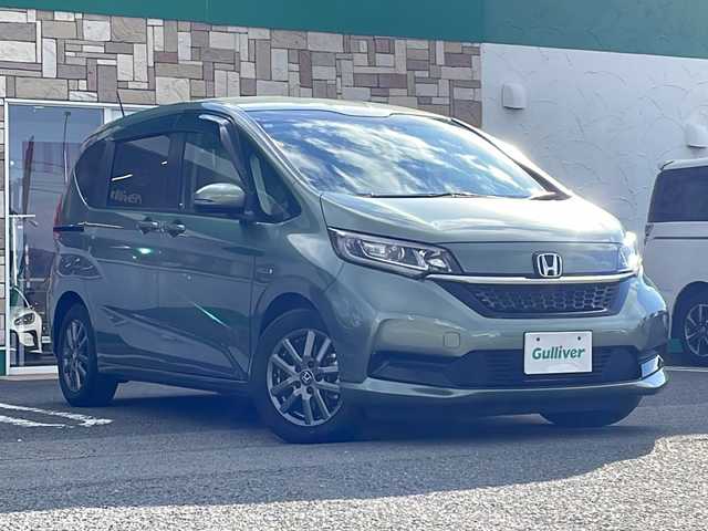 ホンダ フリード ハイブリット G ホンダセンシング 徳島県 2021(令3)年 6万km シルバーミストグリーンM ワンオーナー /無限ドアパーツ /7インチ純正SDナビ（VXM-214VFi）/フルセグTV/Bluetooth/CD/DVD再生機能/iPod/AUX/USB/衝突軽減ブレーキ /禁煙 /両側パワースライドドア /後方コーナーセンサー /クルコン追従有 /レーンキープアシスト/シートヒーター/エアシート /シートカバー付/前方純正ドライブレコーダー /純正AW15インチ/ウィンカーミラー/オートライト