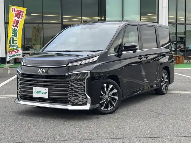 トヨタ ヴォクシー S－Z 奈良県 2023(令5)年 1.5万km アティチュードブラックマイカ 純正10.5インチディスプレイオーディオ/（TV/BT/AppleCarPlay/AndroidAut）/純正14インチフリップダウンモニター（V14T-R72R）/レーダークルーズコントロール/バックカメラ/前後コーナーセンサー/プリクラッシュセーフティ/レーンキープアシスト/両側パワースライドドア/ハーフレザーシート/前席シートヒーター/前後ドライブレコーダー/ETC2.0/LEDヘッドライト/純正17インチAW/保証書/取り扱い説明書/スペアキーX1