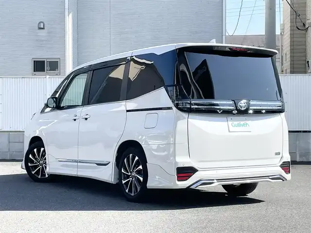 トヨタ ヴォクシー ハイブリッド S－Z 栃木県 2022(令4)年 1.7万km ホワイトパールクリスタルシャイン ワンオーナー/モデリスタエアロ/純正ナビ/（DVD/BT/CD/HDMI/フルセグTV/Miracast/USB）/純正フリップダウンモニター/全方位カメラ/両側パワースライドドア/ヘッドアップディスプレイ/デジタルインナーミラー/パワーバックドア/レーダークルーズコントロール/パーキングアシスト/レーンキープアシスト/オートマチックハイビーム/ハンドルヒーター/ハーフレザーシート/シートヒーター/ドライブレコーダー/2.0ETC/ドアバイザー/保証書/取説/スペアキー