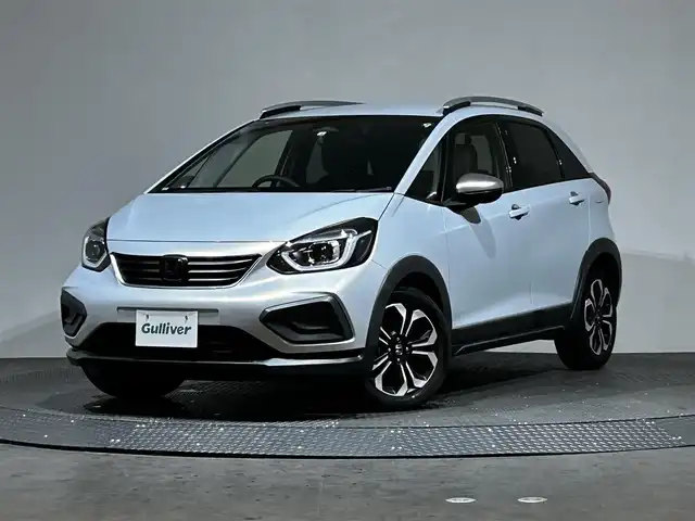 ホンダ フィット e:HEVクロスター 愛媛県 2020(令2)年 8.7万km プレミアムサンライトホワイトパール AA落札成約済み//衝突軽減ブレーキ〈CMBS〉 誤発進抑制機能 後方誤発進抑制機能 近距離衝突軽減ブレーキ 歩行者事故低減ステアリング 路外逸脱抑制機能 渋滞追従機能付アダプティブ・クルーズ・コントロール〈ACC〉 車線維持支援システム〈LKAS〉 先行車発進お知らせ機能 標識認識機能 オートハイビーム 純正SDナビ Bluetooth　フルセグ　バックカメラ　親水/ヒーテッドドアミラー　熱線入りフロントウインドウ　PTCヒーター