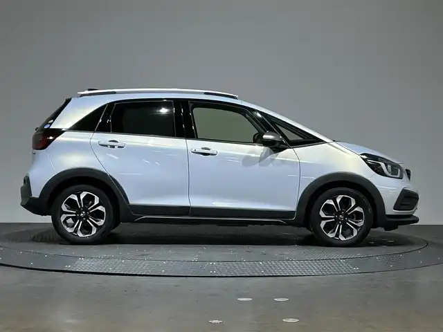 ホンダ フィット e:HEVクロスター 愛媛県 2020(令2)年 8.7万km プレミアムサンライトホワイトパール AA落札成約済み//衝突軽減ブレーキ〈CMBS〉 誤発進抑制機能 後方誤発進抑制機能 近距離衝突軽減ブレーキ 歩行者事故低減ステアリング 路外逸脱抑制機能 渋滞追従機能付アダプティブ・クルーズ・コントロール〈ACC〉 車線維持支援システム〈LKAS〉 先行車発進お知らせ機能 標識認識機能 オートハイビーム 純正SDナビ Bluetooth　フルセグ　バックカメラ　親水/ヒーテッドドアミラー　熱線入りフロントウインドウ　PTCヒーター