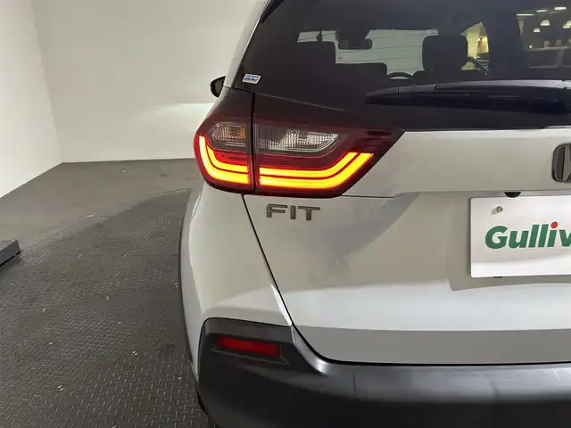 ホンダ フィット e:HEVクロスター 愛媛県 2020(令2)年 8.7万km プレミアムサンライトホワイトパール AA落札成約済み//衝突軽減ブレーキ〈CMBS〉 誤発進抑制機能 後方誤発進抑制機能 近距離衝突軽減ブレーキ 歩行者事故低減ステアリング 路外逸脱抑制機能 渋滞追従機能付アダプティブ・クルーズ・コントロール〈ACC〉 車線維持支援システム〈LKAS〉 先行車発進お知らせ機能 標識認識機能 オートハイビーム 純正SDナビ Bluetooth　フルセグ　バックカメラ　親水/ヒーテッドドアミラー　熱線入りフロントウインドウ　PTCヒーター