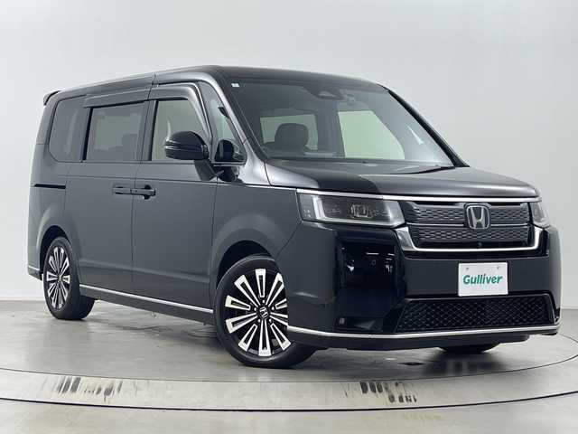 ホンダ ステップワゴン スパーダ eHEV プレミアムライン 埼玉県 2024(令6)年 1.7万km クリスタルブラックパール 純正11．4型SDナビ/（BT/DVD/CD/AM/FM/フルセグTV）/後席モニター/両側パワースライドドア/BSM/前後ドライブレコーダー/ホンダセンシング/・衝突軽減ブレーキ/・誤発進抑制機能/・車線維持支援システム/・アダプティブクルーズコントロール/ハーフレザーシート/シートヒーター/ビルトインETC/前列USB端子/純正アルミホイール