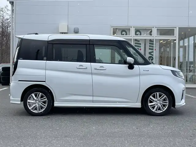 スズキ ソリオ HV MZ 青森県 2021(令3)年 7.3万km ピュアホワイトP ワンオーナー/4WD/セーフティサポート/・デュアルカメラブレーキサポート/・後退時ブレーキサポート/・誤発進抑制機能/・アダプティブクルーズコントロール/・ブラインドスポットモニター/・車線逸脱抑制機能/・ハイビームアシスト/・ヘッドアップディスプレイ/社外メモリナビ/　 CD/DVD/SD/BT/フルセグTV/両側パワースライドドア/LEDオートライト/フォグランプ/純正15インチアルミホイール/シートヒーター/純正エンジンスターター/アイドリングストップ/スマートキー