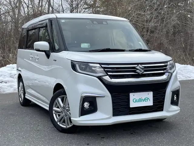 スズキ ソリオ HV MZ 青森県 2021(令3)年 7.3万km ピュアホワイトP ワンオーナー/4WD/セーフティサポート/・デュアルカメラブレーキサポート/・後退時ブレーキサポート/・誤発進抑制機能/・アダプティブクルーズコントロール/・ブラインドスポットモニター/・車線逸脱抑制機能/・ハイビームアシスト/・ヘッドアップディスプレイ/社外メモリナビ/　 CD/DVD/SD/BT/フルセグTV/両側パワースライドドア/LEDオートライト/フォグランプ/純正15インチアルミホイール/シートヒーター/純正エンジンスターター/アイドリングストップ/スマートキー