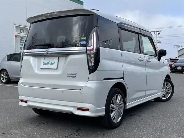 スズキ ソリオ HV MZ 青森県 2021(令3)年 7.3万km ピュアホワイトP ワンオーナー/4WD/セーフティサポート/・デュアルカメラブレーキサポート/・後退時ブレーキサポート/・誤発進抑制機能/・アダプティブクルーズコントロール/・ブラインドスポットモニター/・車線逸脱抑制機能/・ハイビームアシスト/・ヘッドアップディスプレイ/社外メモリナビ/　 CD/DVD/SD/BT/フルセグTV/両側パワースライドドア/LEDオートライト/フォグランプ/純正15インチアルミホイール/シートヒーター/純正エンジンスターター/アイドリングストップ/スマートキー