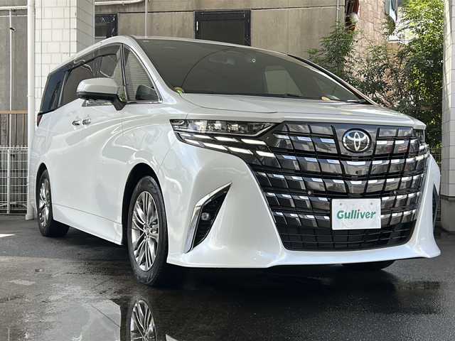 トヨタ アルファードハイブリット Z 京都府 2023(令5)年 1.5万km プラチナホワイトパールマイカ 純正ディスプレイオーディオナビ/フルセグTV/Bluetooth/Miracast/HDMI/FM/AM/全方位カメラ/ツインムーンルーフ/3眼LEDヘッドライト/後席用パワーサンシェード/両側パワースライドドア/パワーバックドア/運転席ポジションメモリー/全席パワーシート/全席シートヒーター/全席エアーシート/ステアリングヒーター/ステアリングスイッチ/前後ドラレコ/ビルトインETC2.0/純正フロアマット/純正ドアバイザー/電格ウィンカーミラー/トヨタセーフティセンス/BSM/置くだけ充電/禁煙車