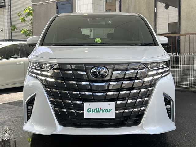トヨタ アルファードハイブリット Z 京都府 2023(令5)年 1.5万km プラチナホワイトパールマイカ 純正ディスプレイオーディオナビ/フルセグTV/Bluetooth/Miracast/HDMI/FM/AM/全方位カメラ/ツインムーンルーフ/3眼LEDヘッドライト/後席用パワーサンシェード/両側パワースライドドア/パワーバックドア/運転席ポジションメモリー/全席パワーシート/全席シートヒーター/全席エアーシート/ステアリングヒーター/ステアリングスイッチ/前後ドラレコ/ビルトインETC2.0/純正フロアマット/純正ドアバイザー/電格ウィンカーミラー/トヨタセーフティセンス/BSM/置くだけ充電/禁煙車