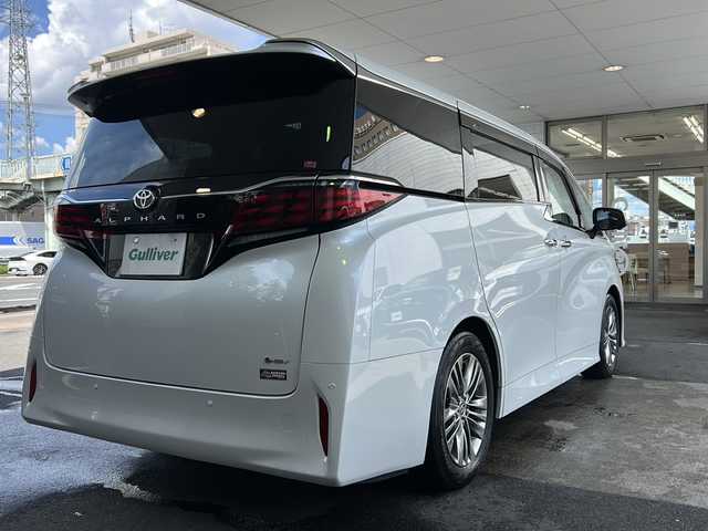 トヨタ アルファードハイブリット Z 京都府 2023(令5)年 1.5万km プラチナホワイトパールマイカ 純正ディスプレイオーディオナビ/フルセグTV/Bluetooth/Miracast/HDMI/FM/AM/全方位カメラ/ツインムーンルーフ/3眼LEDヘッドライト/後席用パワーサンシェード/両側パワースライドドア/パワーバックドア/運転席ポジションメモリー/全席パワーシート/全席シートヒーター/全席エアーシート/ステアリングヒーター/ステアリングスイッチ/前後ドラレコ/ビルトインETC2.0/純正フロアマット/純正ドアバイザー/電格ウィンカーミラー/トヨタセーフティセンス/BSM/置くだけ充電/禁煙車