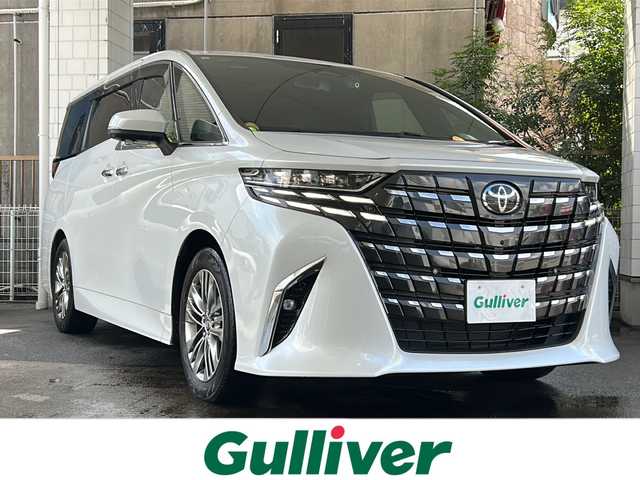 トヨタ アルファードハイブリット Z 京都府 2023(令5)年 1.5万km プラチナホワイトパールマイカ 純正ディスプレイオーディオナビ/フルセグTV/Bluetooth/Miracast/HDMI/FM/AM/全方位カメラ/ツインムーンルーフ/3眼LEDヘッドライト/後席用パワーサンシェード/両側パワースライドドア/パワーバックドア/運転席ポジションメモリー/全席パワーシート/全席シートヒーター/全席エアーシート/ステアリングヒーター/ステアリングスイッチ/前後ドラレコ/ビルトインETC2.0/純正フロアマット/純正ドアバイザー/電格ウィンカーミラー/トヨタセーフティセンス/BSM/置くだけ充電/禁煙車