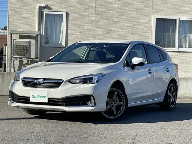 スバル インプレッサ スポーツ 2．0i－L アイサイト 青森県 2019(令1)年 1.8万km クリスタルホワイトP ワンオーナー/純正8インチメモリナビ【NR-MZ300-BIN-4】/(AM/FM/CD/DVD/MusicFolder/iPod/Bluetooth/フルセグTV)/バック/サイド/アイサイト/・プリクラッシュブレーキ/・全車速追従機能付クルーズコントロール/・定速クルーズコントロール/・アクティブレーンキープ/・AT誤発進/誤後進抑制制御/後側方警戒支援システム/横滑り防止/オートビークルホールド/電動パーキングブレーキ/社外18インチアルミホイール/Panasonic前方ドライブレコーダー【CA-DR03TDFA】/革巻きステアリング/パドルシフト/ステアリングスイッチ/シートメモリー(D)/パワーシート(D/N)/純正フロアマット/USB端子/アクセサリーソケット/スペアキー×1/エンジンスターター/保証書/取扱説明書/ナビ取扱説明書