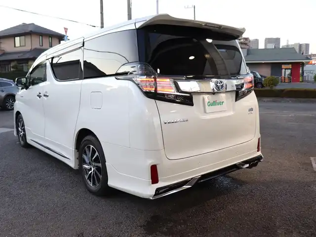 トヨタ ヴェルファイア ハイブリット ZR Gエディション 神奈川県 2016(平28)年 3.8万km ホワイトパールクリスタルシャイン モデリスタエアロ/モデリスタマフラー/寒冷地仕様/純正１０型ナビ/フルセグＴＶ/置くだけ充電/インテリアイルミネーション/ＴＶキャンセラー/ステアリングヒーター/前席シートヒーター/パワーバックドア/オートマチックハイビーム/ETC/両側パワースライドドア/黒革シート/クルーズコントロール