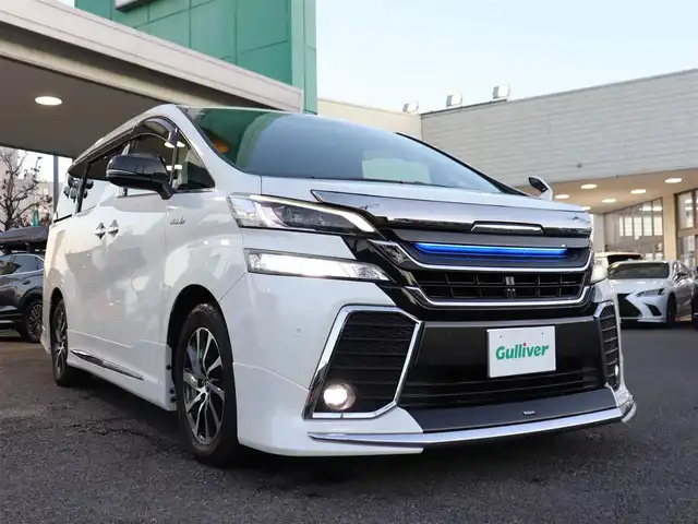 トヨタ ヴェルファイア ハイブリット ZR Gエディション 神奈川県 2016(平28)年 3.8万km ホワイトパールクリスタルシャイン モデリスタエアロ/モデリスタマフラー/寒冷地仕様/純正１０型ナビ/フルセグＴＶ/置くだけ充電/インテリアイルミネーション/ＴＶキャンセラー/ステアリングヒーター/前席シートヒーター/パワーバックドア/オートマチックハイビーム/ETC/両側パワースライドドア/黒革シート/クルーズコントロール