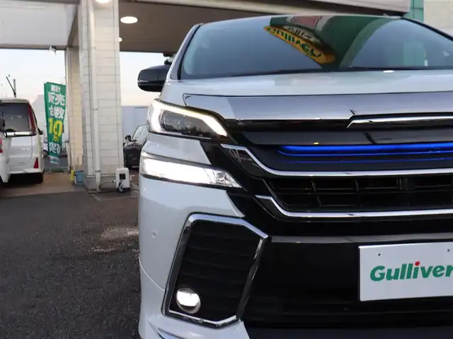トヨタ ヴェルファイア ハイブリット ZR Gエディション 神奈川県 2016(平28)年 3.8万km ホワイトパールクリスタルシャイン モデリスタエアロ/モデリスタマフラー/寒冷地仕様/純正１０型ナビ/フルセグＴＶ/置くだけ充電/インテリアイルミネーション/ＴＶキャンセラー/ステアリングヒーター/前席シートヒーター/パワーバックドア/オートマチックハイビーム/ETC/両側パワースライドドア/黒革シート/クルーズコントロール