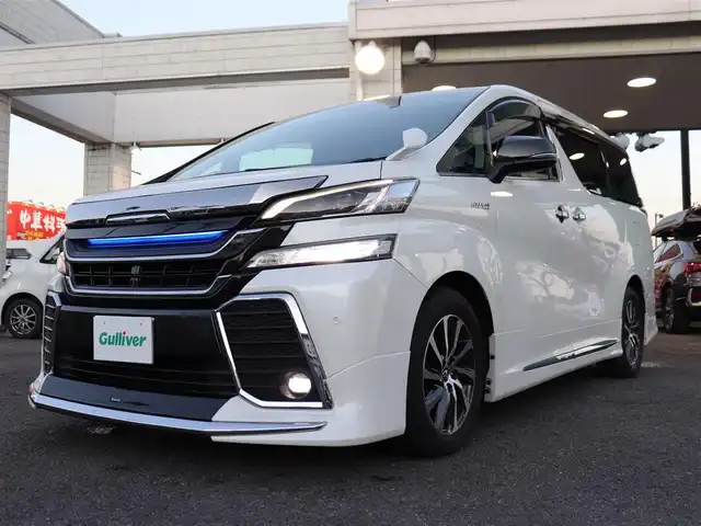 トヨタ ヴェルファイア ハイブリット ZR Gエディション 神奈川県 2016(平28)年 3.8万km ホワイトパールクリスタルシャイン モデリスタエアロ/モデリスタマフラー/寒冷地仕様/純正１０型ナビ/フルセグＴＶ/置くだけ充電/インテリアイルミネーション/ＴＶキャンセラー/ステアリングヒーター/前席シートヒーター/パワーバックドア/オートマチックハイビーム/ETC/両側パワースライドドア/黒革シート/クルーズコントロール