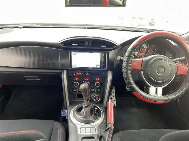 トヨタ ８６ GT 鹿児島県 2013(平25)年 12.1万km ライトニングレッド 社外SDナビ/（AM/FM/CD/DVD/Bluetooth）/バックカメラ/モデリスタエアロ/パドルシフト/ガナドール製マフラー/社外AW（ENKEI）/純正フロアマット/スマートキー /AAC/オートライト