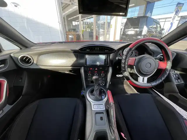 トヨタ ８６ GT 三重県 2013(平25)年 12.1万km ライトニングレッド (株)IDOMが運営する【じしゃロン四日市店】の自社ローン専用車両になります。こちらは現金またはオートローンご利用時の価格です。自社ローンご希望の方は別途その旨お申付け下さい/社外SDナビ/（AM/FM/CD/DVD/Bluetooth）/バックカメラ/モデリスタエアロ/パドルシフト/ガナドール製マフラー/社外AW（ENKEI）/純正フロアマット/スマートキー /AAC/オートライト